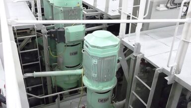 DESMI engine room pumps installed in a ship’s machinery space with railings