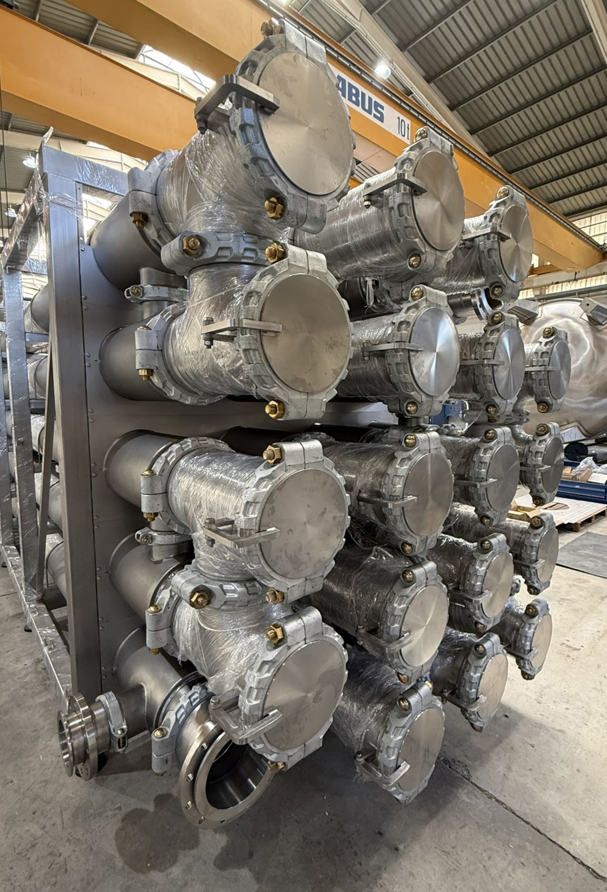 End of the heat exchanger array showing hinged hatches with Victaulic connections on each tube