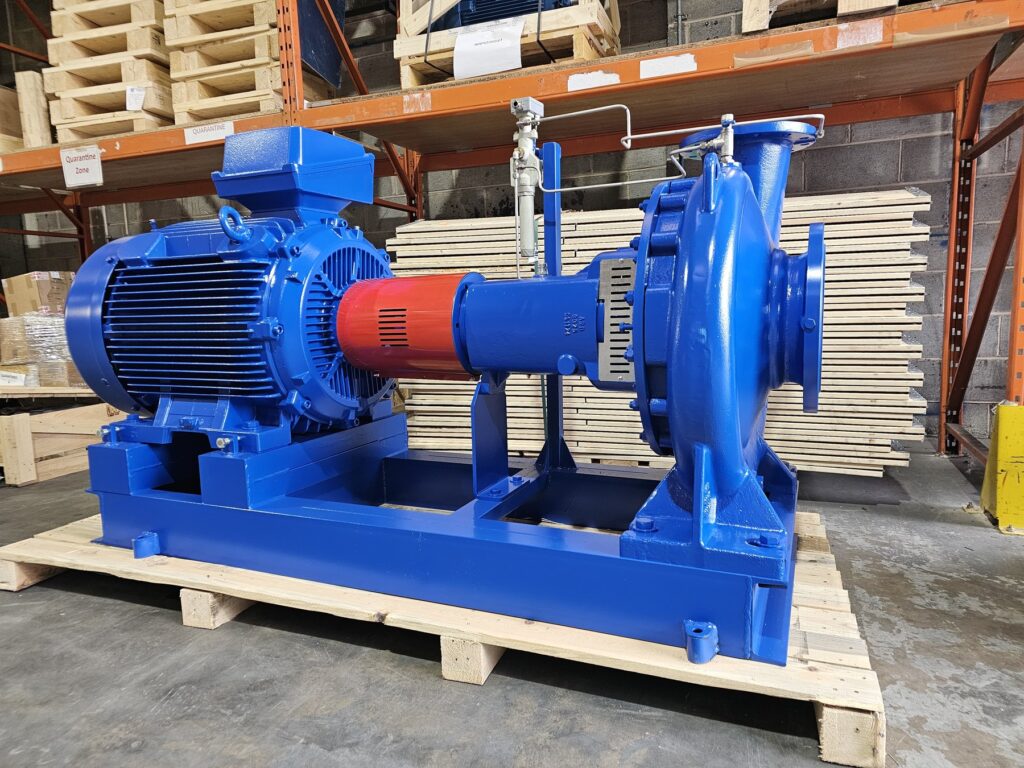 High flow self-priming pump with air ejector, motor and baseplate on a pallet in a North Ridge Pumps warehouse