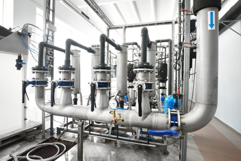 Stainless steel piping skid with filter housings, valves and gauges