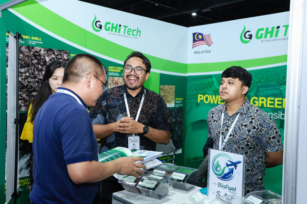 Visitors talking with exhibitors at a stand on the show floor of ASEAN Biomass Energy Expo in Bangkok