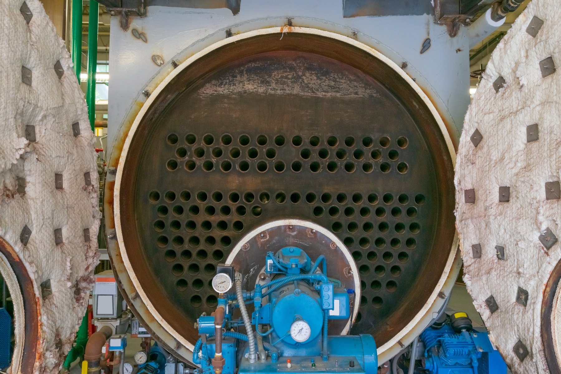 Open firetube boiler with exposed tube sheet and burner assembly during seasonal layup