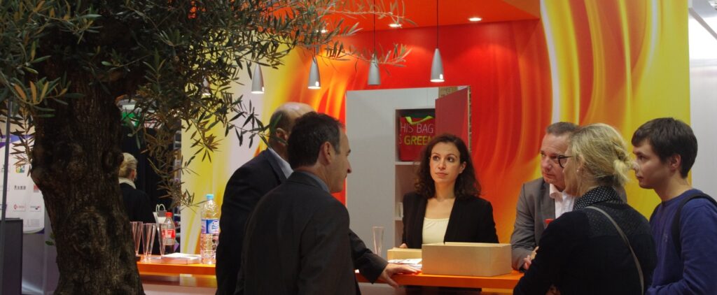 Visitors at an exhibitor stand at Eurocoat, Paris Expo Porte de Versailles