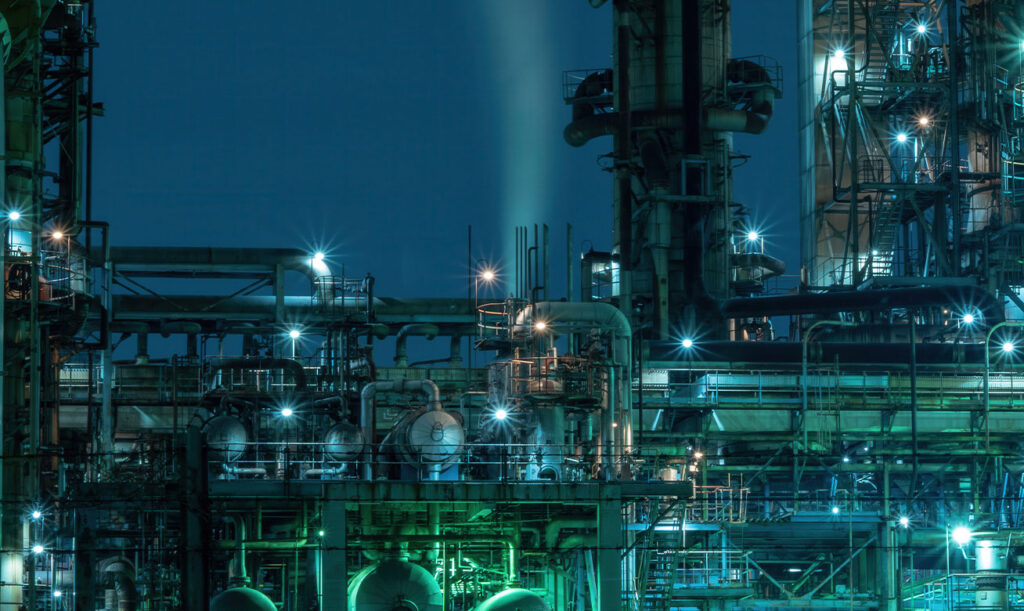 Petrochemical processing plant lit up at night