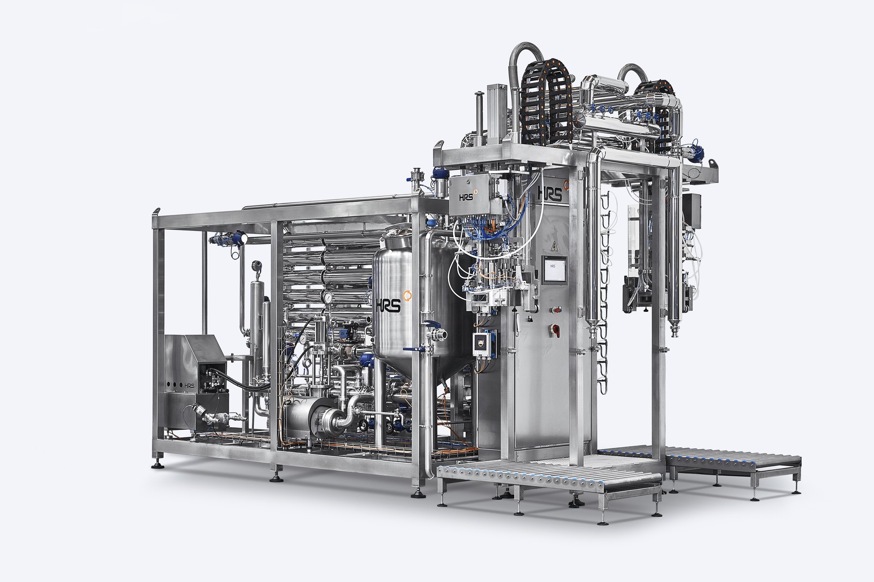 HRS Asepticblock combining a pasteuriser skid with an aseptic filling head and roller conveyors