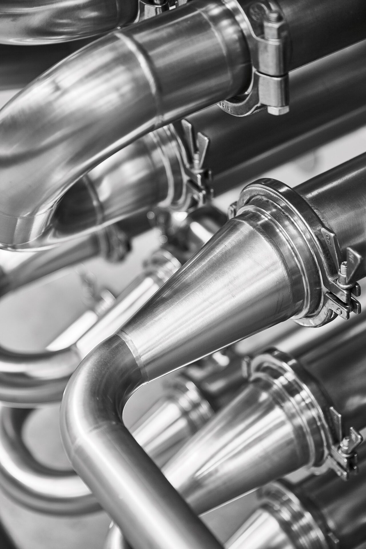 Close-up of stainless steel corrugated tubes and fittings of an HRS heat exchanger