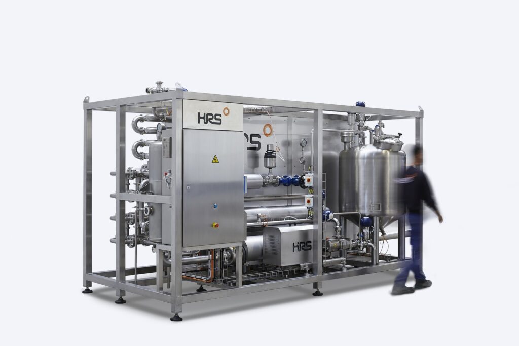 Compact HRS Thermblock pasteuriser on a stainless steel skid frame with control cabinet and product tank