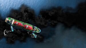 Aerial view of an oil tanker with tugboats surrounded by an oil slick at sea, illustrating pipeline leak detection with electrical resistance tomography