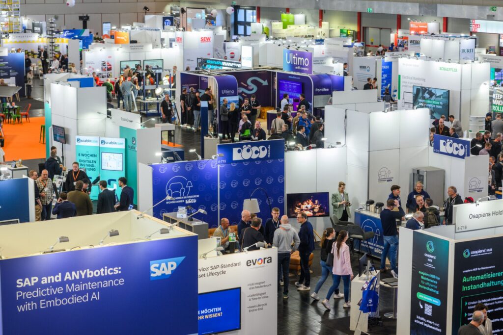 Visitors and exhibitor stands in the exhibition hall at Messe Dortmund