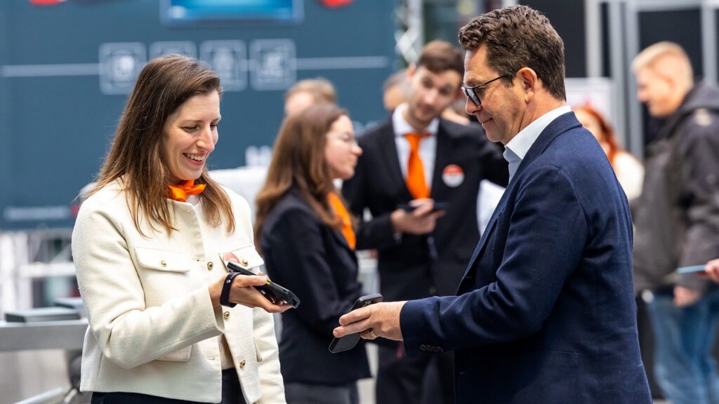 Visitors scanning tickets at the entrance of SPS Smart Production Solutions in Nuremberg