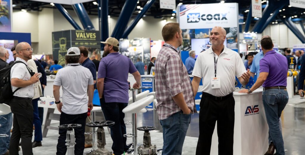 Visitors meeting on the expo floor of Valve World Americas in Houston
